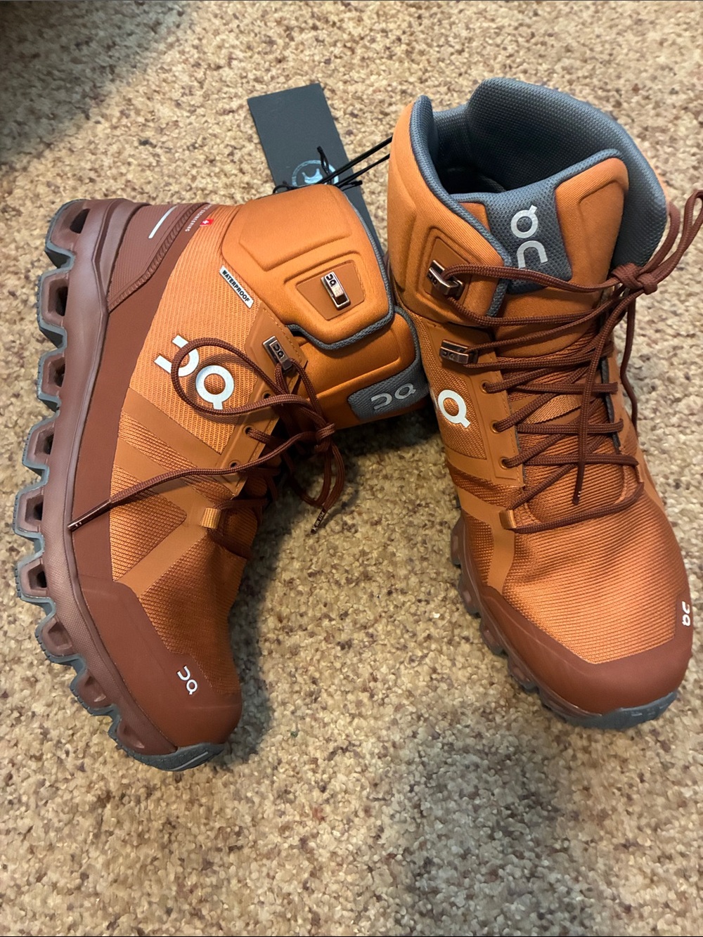 On cloud Women’s Lace-Up Trail Boots in Rust Orange and Brown